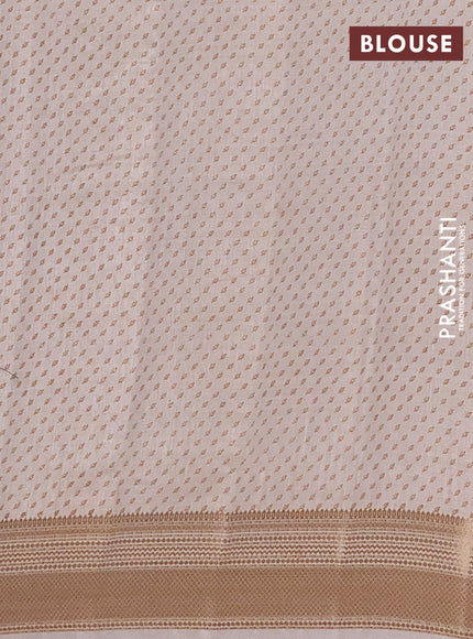 Semi raw silk saree cream with allover butta prints and zari woven border