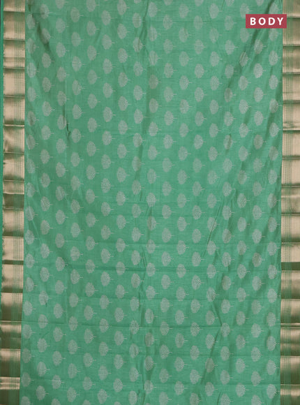 Semi raw silk saree light green with allover butta prints and zari woven border
