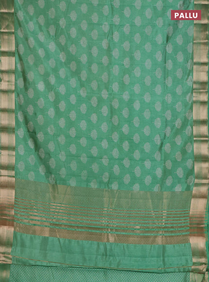 Semi raw silk saree light green with allover butta prints and zari woven border