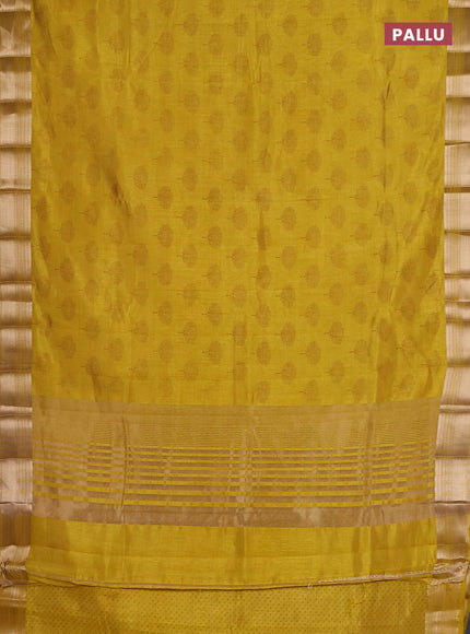 Semi raw silk saree lime yellow with allover butta prints and zari woven border