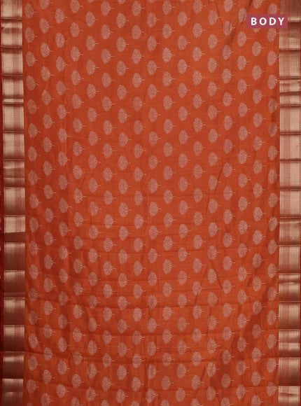 Semi raw silk saree rust shade with allover butta prints and zari woven border