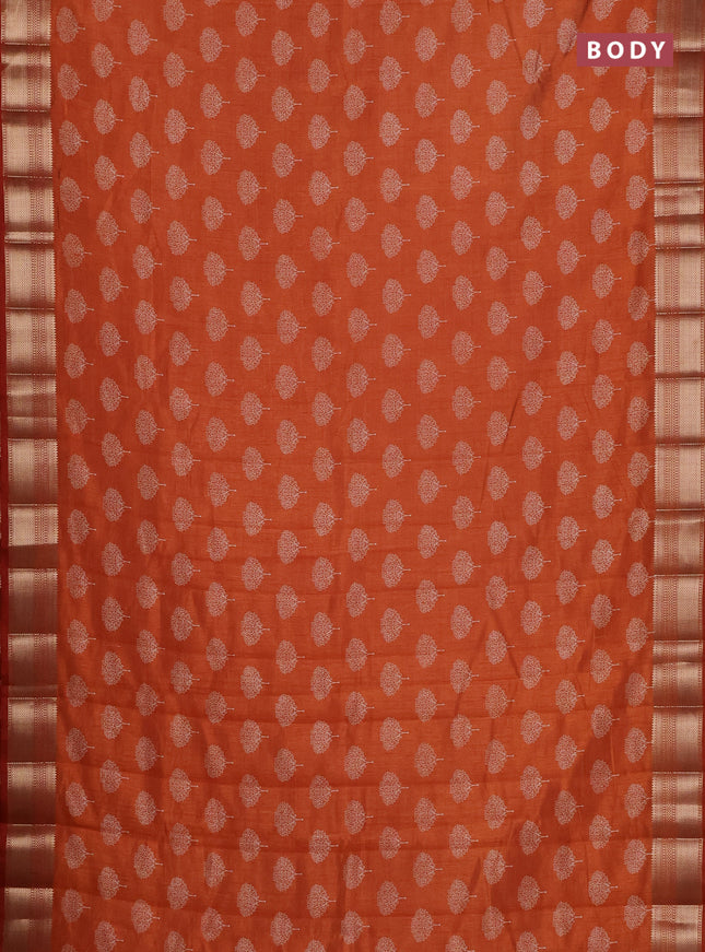 Semi raw silk saree rust shade with allover butta prints and zari woven border