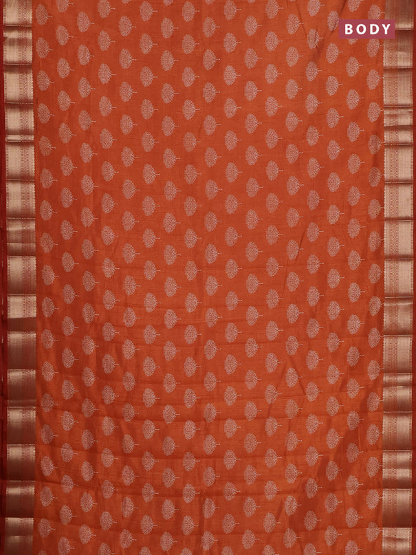 Semi raw silk saree rust shade with allover butta prints and zari woven border