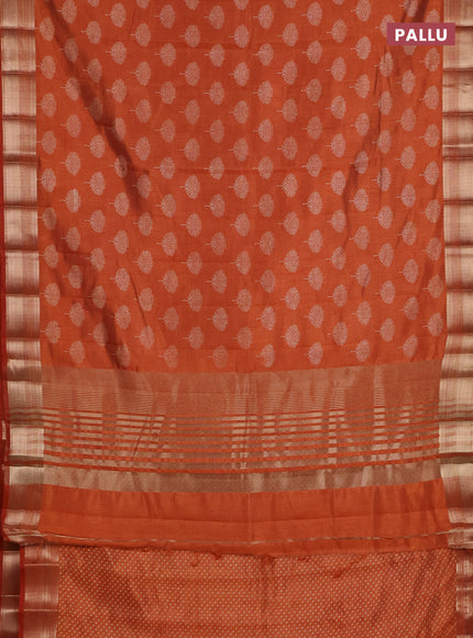 Semi raw silk saree rust shade with allover butta prints and zari woven border