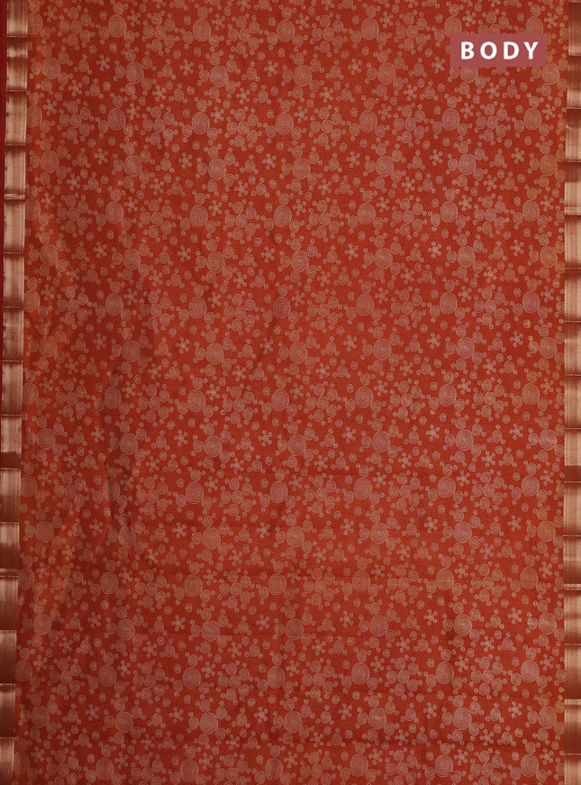 Semi raw silk saree rust shade with allover geometric prints and zari woven border