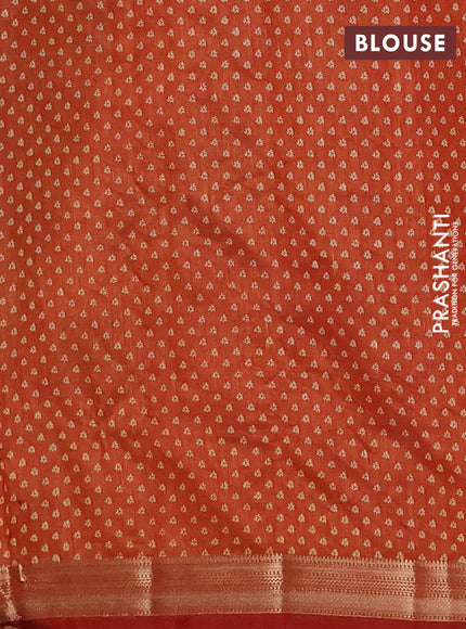 Semi raw silk saree rust shade with allover geometric prints and zari woven border