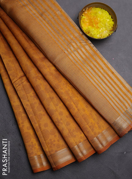 Semi raw silk saree dark mustard yellow with allover geometric prints and zari woven border