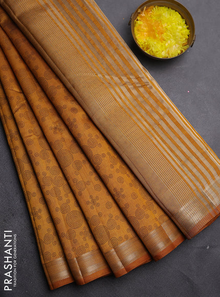 Semi raw silk saree dark mustard with allover geometric prints and zari woven border