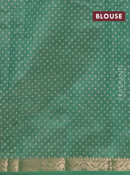 Semi raw silk saree green with allover geometric prints and zari woven border