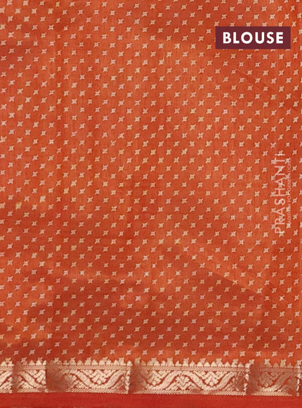 Semi raw silk saree rust shade with allover geometric prints and zari woven border