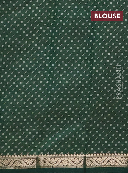 Semi raw silk saree bottle green with allover geometric prints and zari woven border