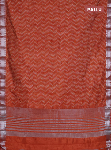 Semi raw silk saree rust shade with allover zigzag prints and zari woven border