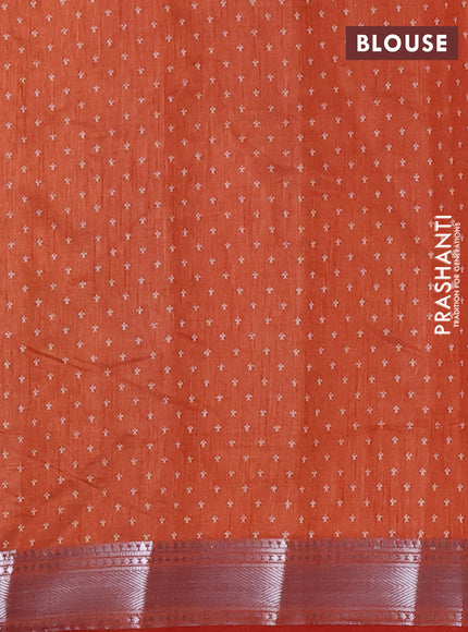Semi raw silk saree rust shade with allover zigzag prints and zari woven border