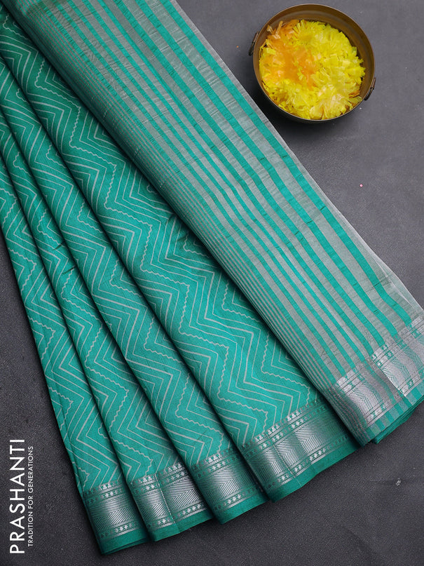 Semi raw silk saree teal blue with allover zigzag prints and zari woven border