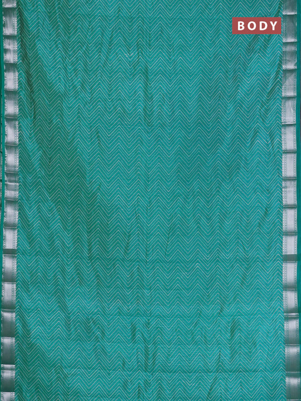 Semi raw silk saree teal blue with allover zigzag prints and zari woven border