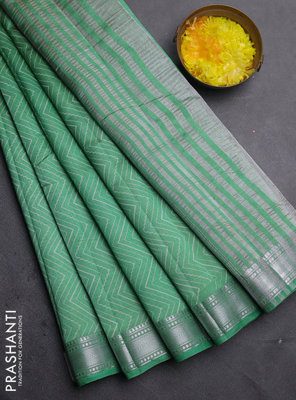 Semi raw silk saree green with allover zigzag prints and zari woven border