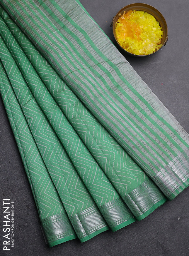 Semi raw silk saree green with allover zigzag prints and zari woven border