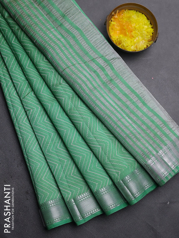 Semi raw silk saree green with allover zigzag prints and zari woven border