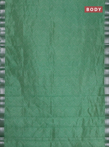 Semi raw silk saree green with allover zigzag prints and zari woven border