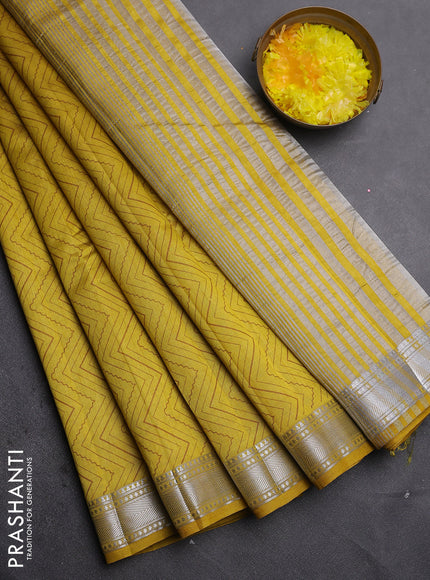 Semi raw silk saree lime yellow with allover zigzag prints and zari woven border