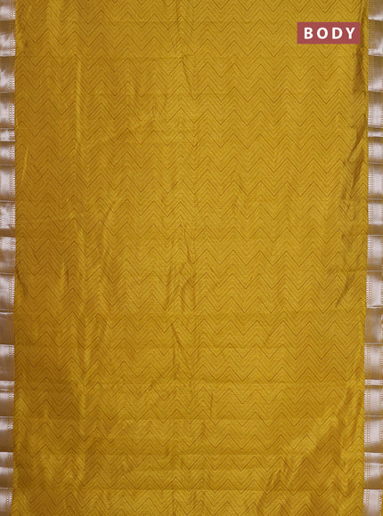 Semi raw silk saree lime yellow with allover zigzag prints and zari woven border