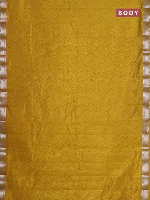 Semi raw silk saree lime yellow with allover zigzag prints and zari woven border