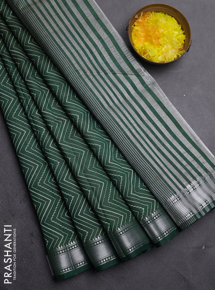 Semi raw silk saree bottle green with allover zigzag prints and zari woven border
