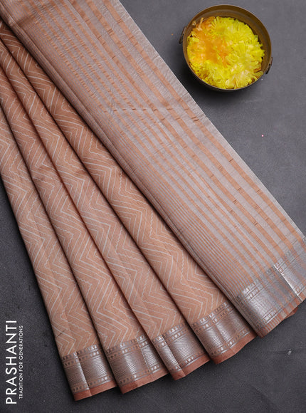 Semi raw silk saree pastel peach with allover zigzag prints and zari woven border