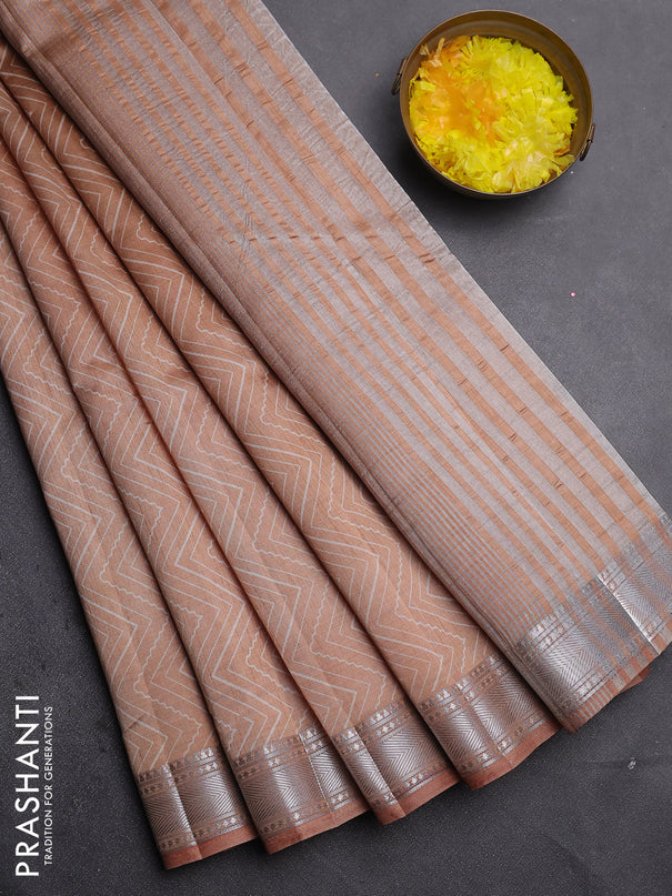 Semi raw silk saree pastel peach with allover zigzag prints and zari woven border