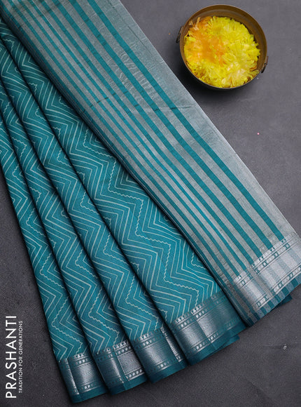Semi raw silk saree cs blue with allover zigzag prints and zari woven border