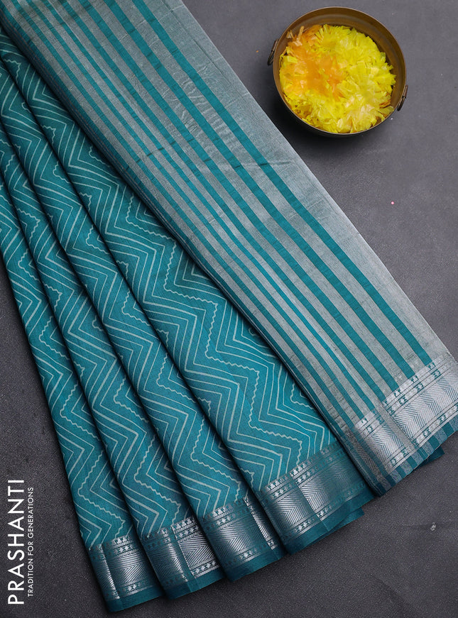 Semi raw silk saree cs blue with allover zigzag prints and zari woven border