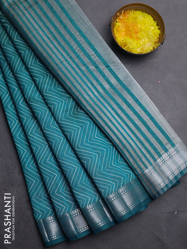 Semi raw silk saree cs blue with allover zigzag prints and zari woven border