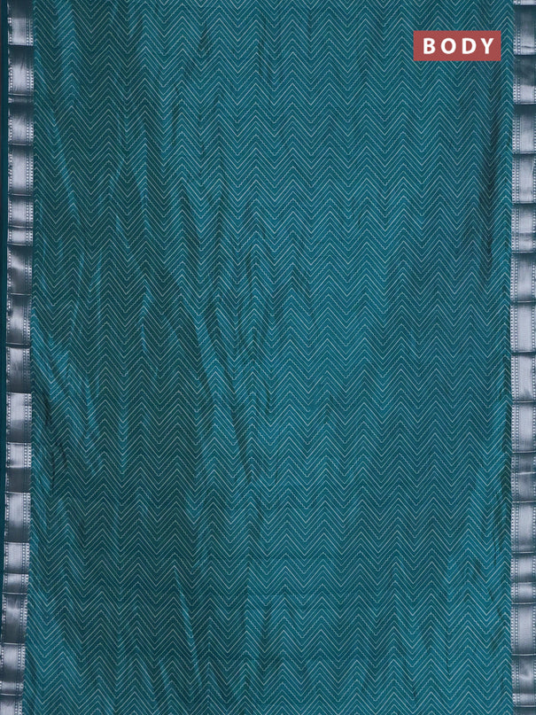 Semi raw silk saree cs blue with allover zigzag prints and zari woven border