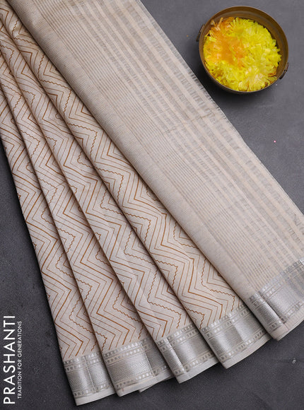 Semi raw silk saree cream with allover zigzag prints and zari woven border