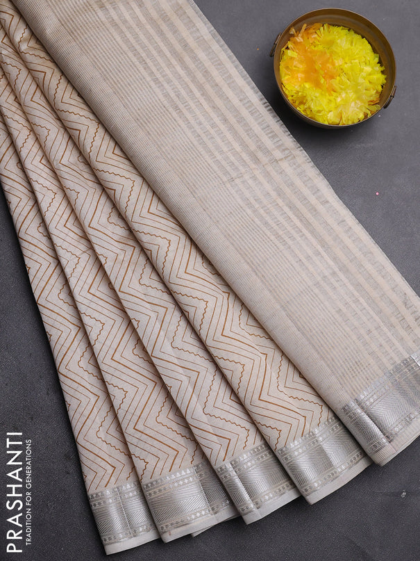 Semi raw silk saree cream with allover zigzag prints and zari woven border