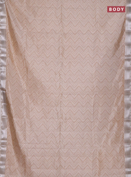 Semi raw silk saree cream with allover zigzag prints and zari woven border