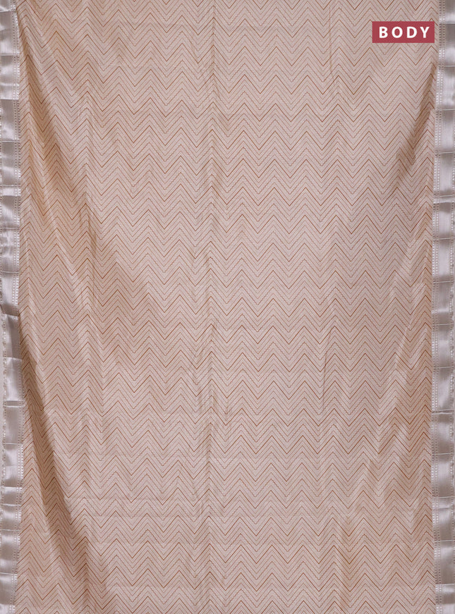 Semi raw silk saree cream with allover zigzag prints and zari woven border