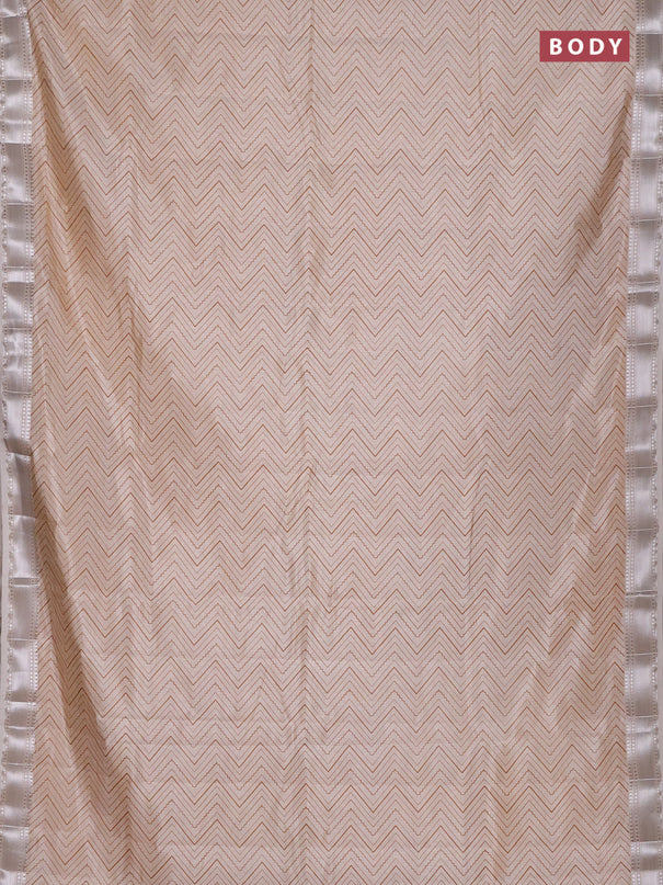 Semi raw silk saree cream with allover zigzag prints and zari woven border