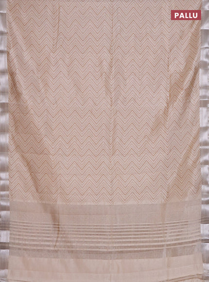 Semi raw silk saree cream with allover zigzag prints and zari woven border