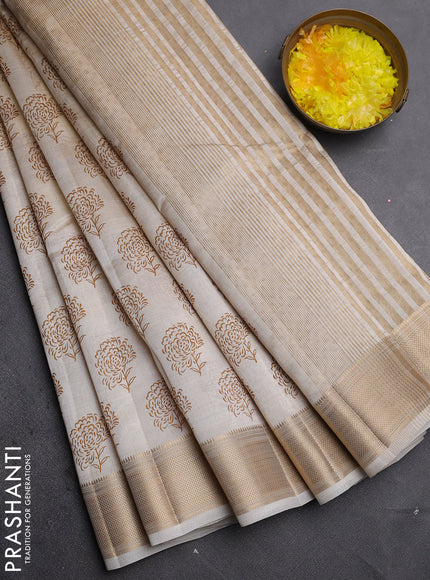 Semi raw silk saree cream with allover floral prints and zari woven border