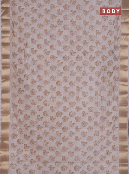 Semi raw silk saree cream with allover floral prints and zari woven border