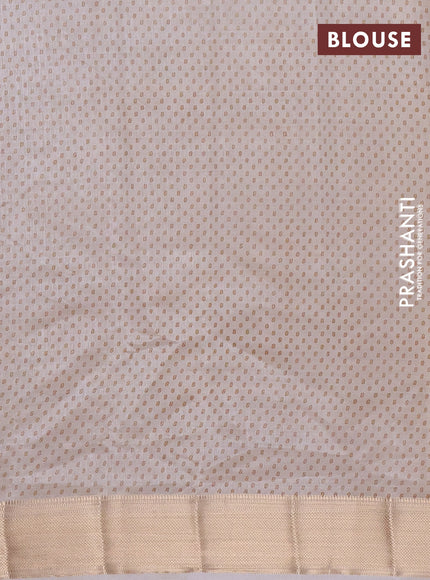 Semi raw silk saree cream with allover floral prints and zari woven border