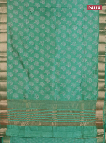 Semi raw silk saree light green with allover floral prints and zari woven border