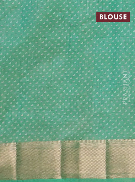 Semi raw silk saree light green with allover floral prints and zari woven border