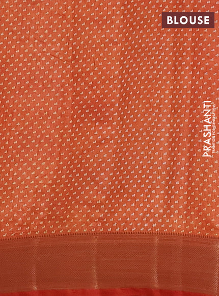 Semi raw silk saree rust shade with allover floral prints and zari woven border