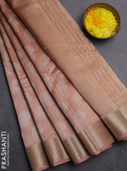 Semi raw silk saree pastel peach with allover floral prints and zari woven border