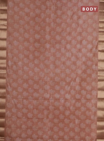 Semi raw silk saree pastel peach with allover floral prints and zari woven border