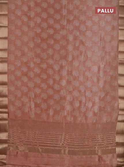 Semi raw silk saree pastel peach with allover floral prints and zari woven border