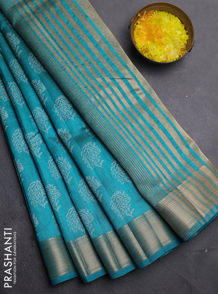 Semi raw silk saree teal green with allover floral prints and zari woven border