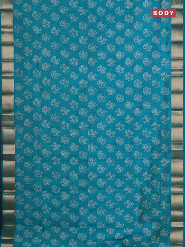 Semi raw silk saree teal green with allover floral prints and zari woven border